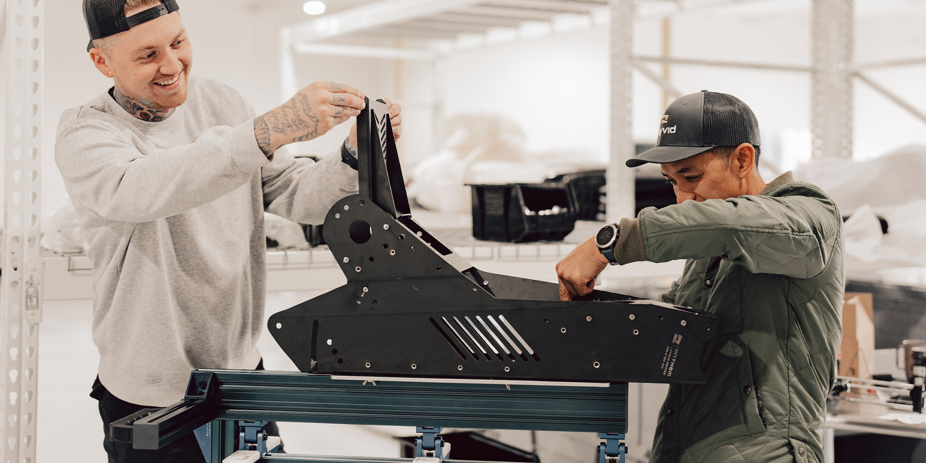 Engineers working on electric motorcycle chassis in California facility