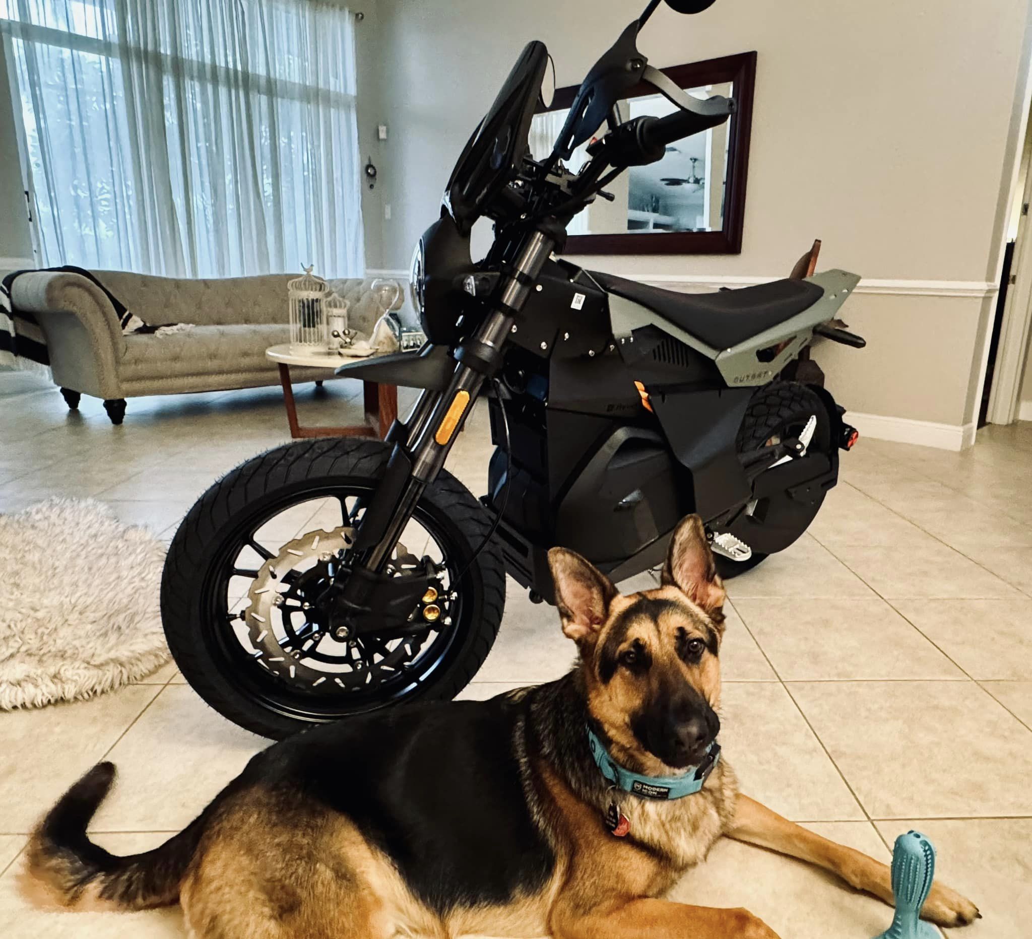 Ryvid OUTSET electric motorcycle rider in action